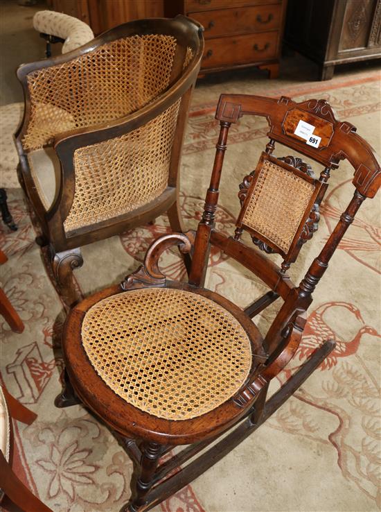 A late Victorian caned seat and back rocking chair and a walnut framed single caned tub shaped bergere arm chair